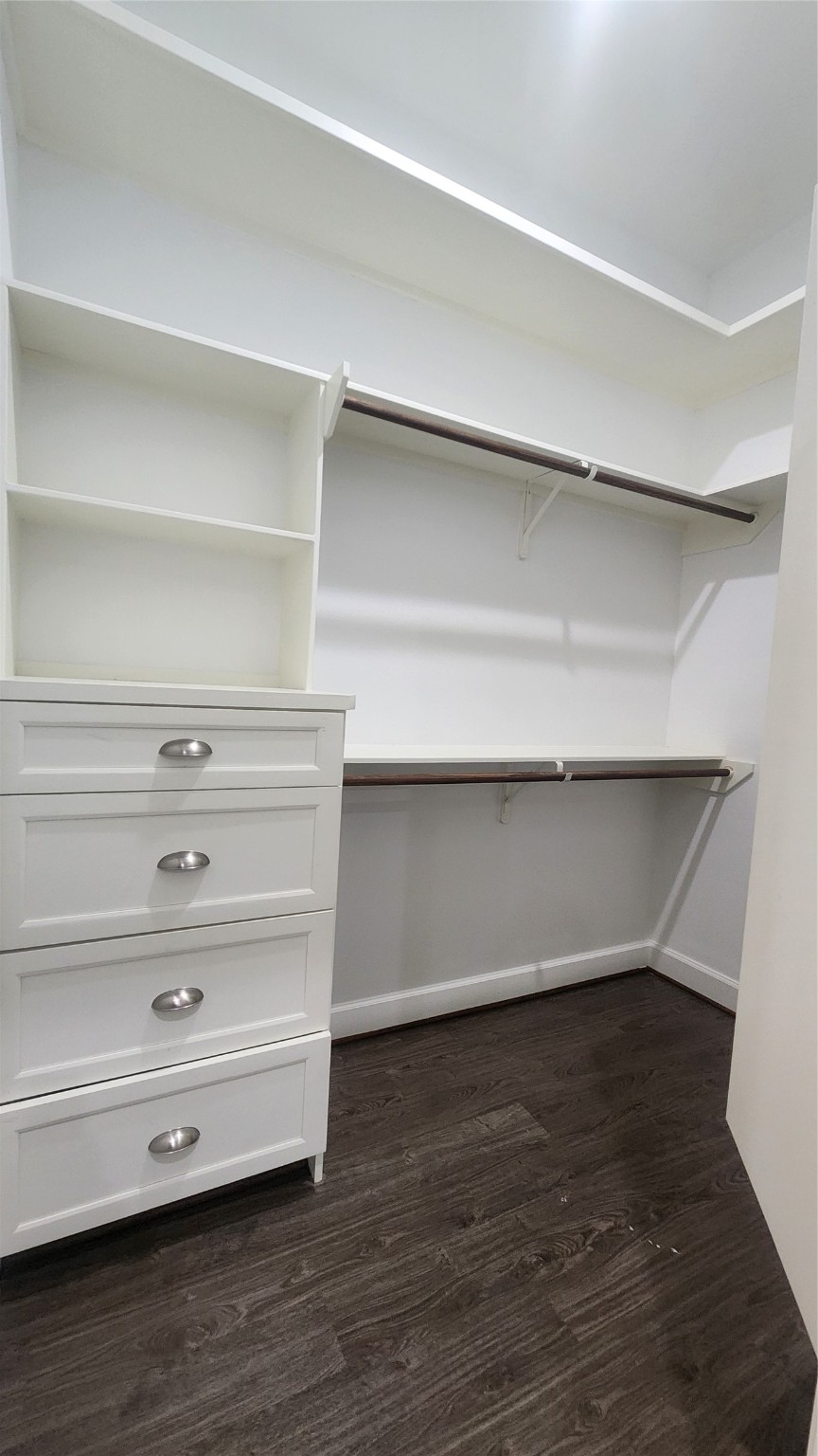 7828 Pardee Street Houston, TX 77028 - Photo 10 of 18 a view of walk in closet with empty racks