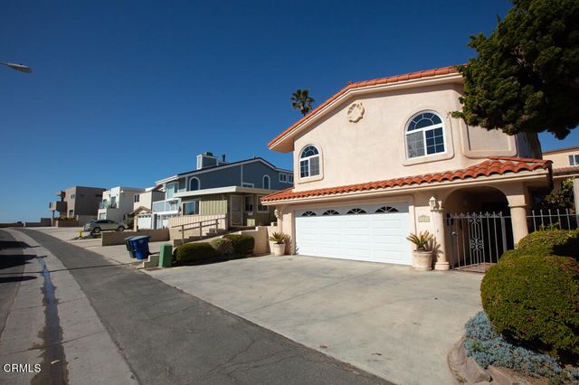 a front view of a house with a garage