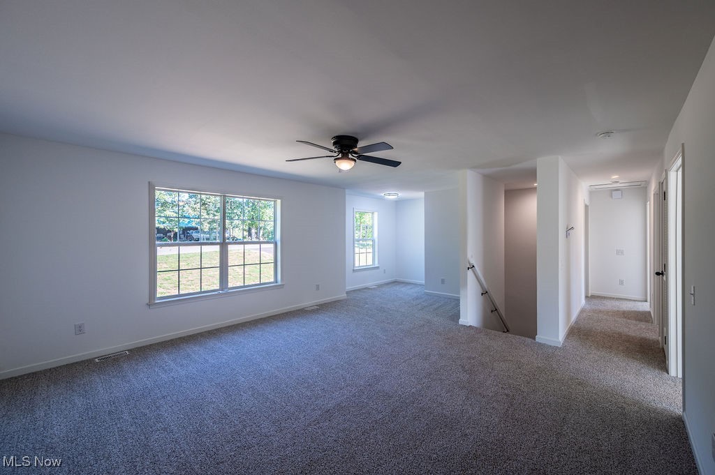 7343 Lost Pavement Road Belleville, WV 26133 - Photo 19 of 49 Unfurnished room with carpet floors and ceiling fan