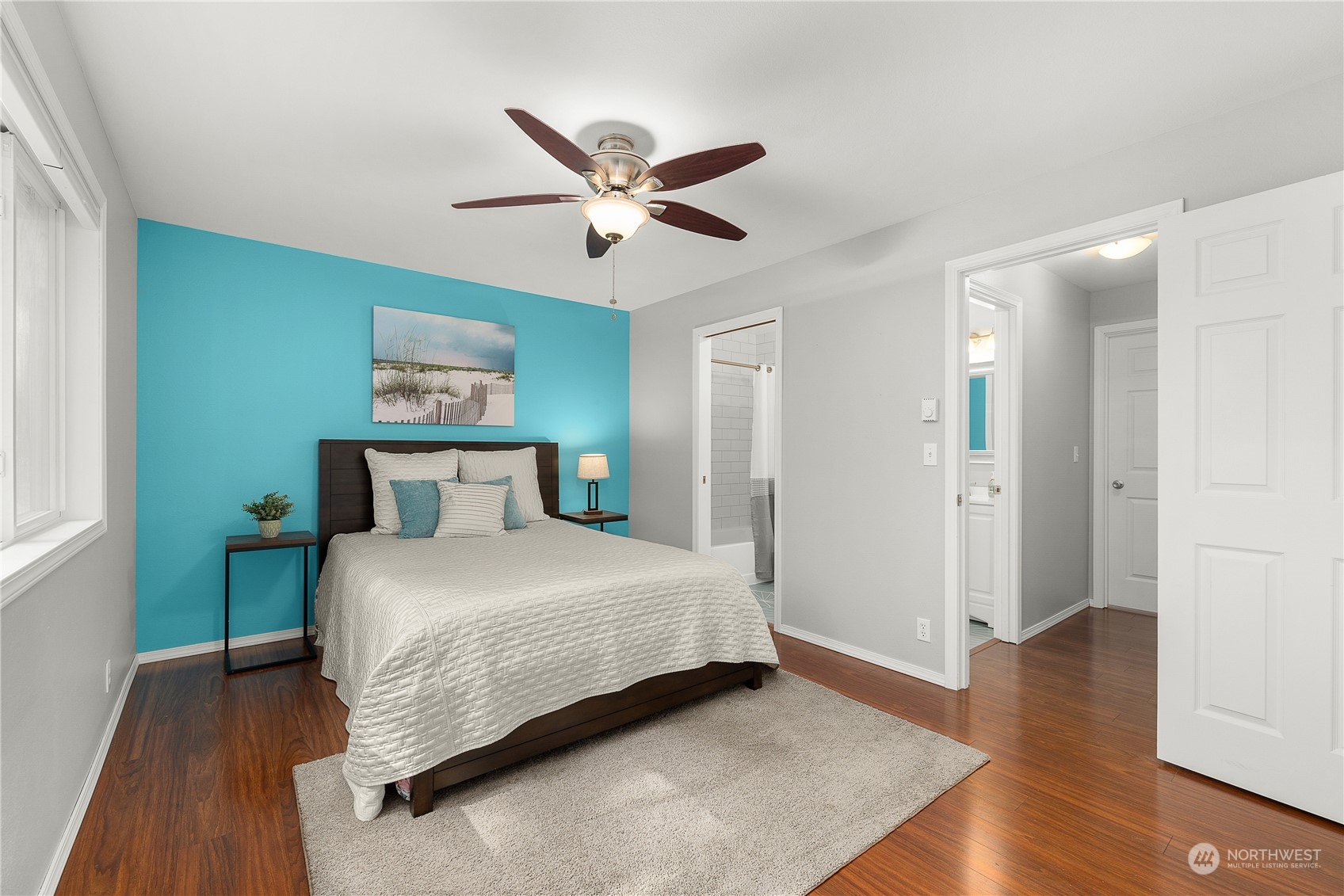 1526 192nd Street Southeast, Unit S2 Bothell, WA 98012 - Photo 13 of 16 a bedroom with a bed and wooden floor