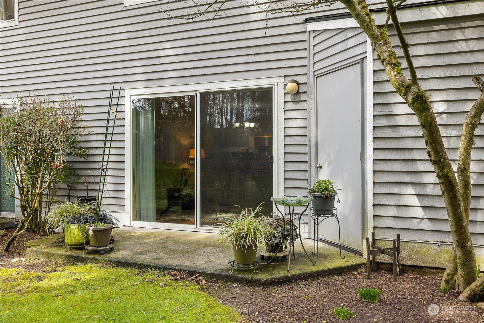 1526 192nd Street Southeast, Unit S2 Bothell, WA 98012 - Photo 15 of 16 a view of a house with backyard and sitting area