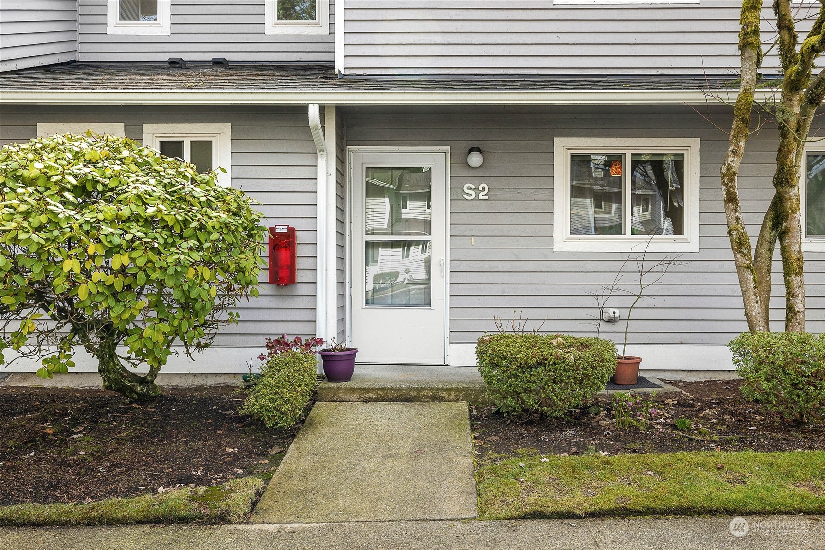 1526 192nd Street Southeast, Unit S2 Bothell, WA 98012 - Photo 2 of 16 a view of a house with outdoor space