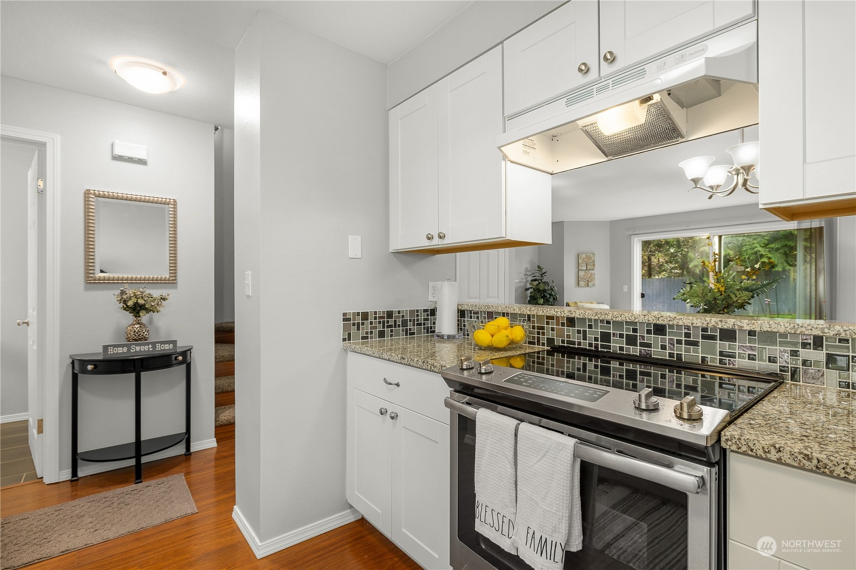 1526 192nd Street Southeast, Unit S2 Bothell, WA 98012 - Photo 3 of 16 a kitchen with a stove and a sink