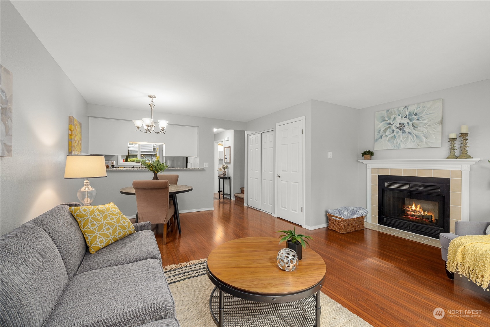 1526 192nd Street Southeast, Unit S2 Bothell, WA 98012 - Photo 10 of 16 a living room with furniture and a fireplace