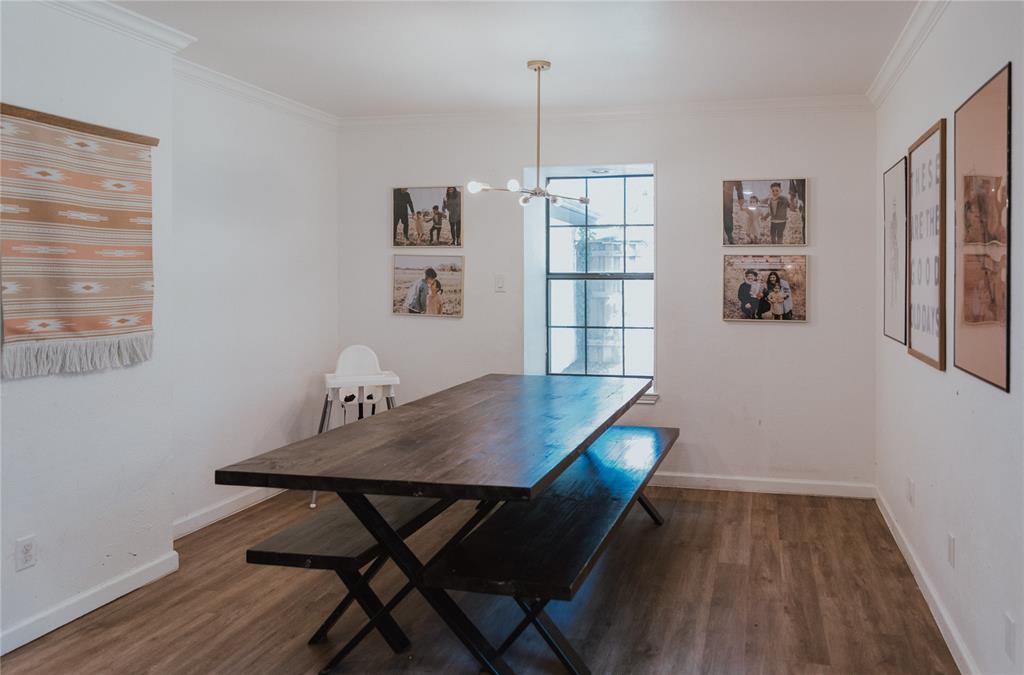 312 Perkins Road Krugerville, TX 76227 - Photo 14 of 32 a view of a dining room with furniture window and wooden floor