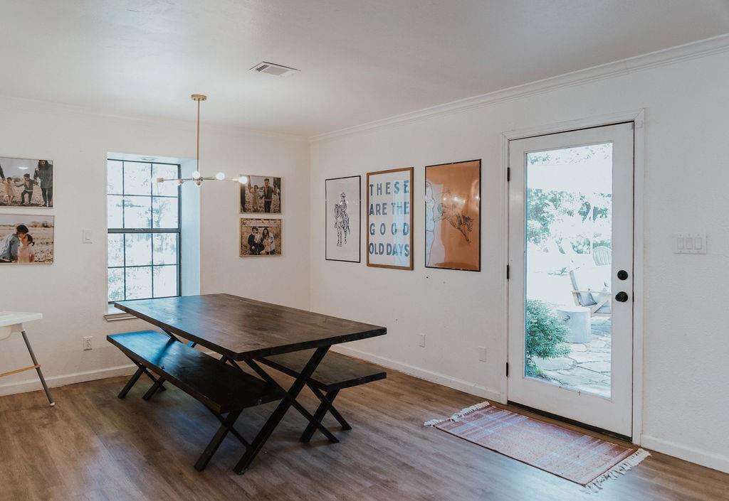 312 Perkins Road Krugerville, TX 76227 - Photo 15 of 32 a view of a dining room with furniture window and wooden floor