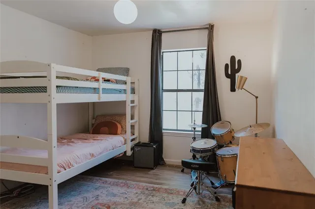 a view of a utility room with cabinet and stairs