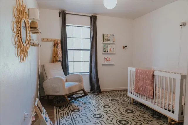 a bathroom with a toilet and a mirror