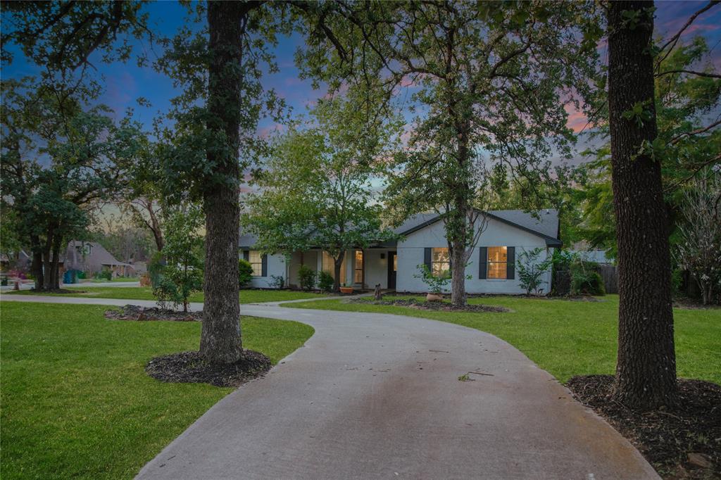 312 Perkins Road Krugerville, TX 76227 - Photo 2 of 32 a front view of a house with a yard and trees
