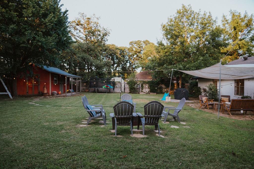 312 Perkins Road Krugerville, TX 76227 - Photo 25 of 32 a view of a house with a yard patio and fire pit