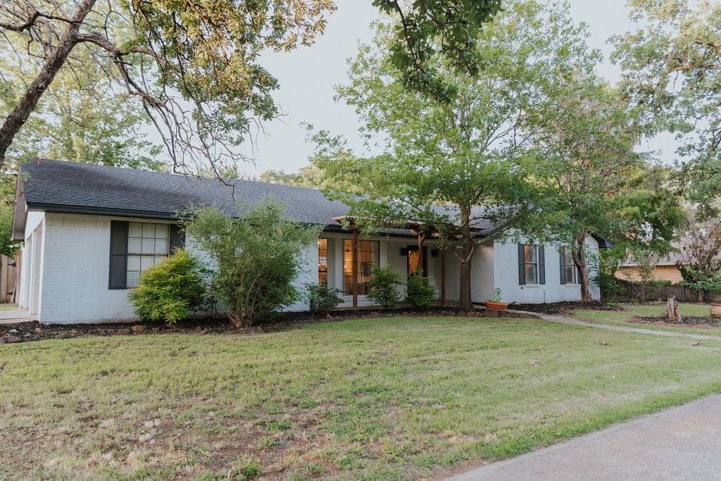 312 Perkins Road Krugerville, TX 76227 - Photo 5 of 32 a view of a house with a yard
