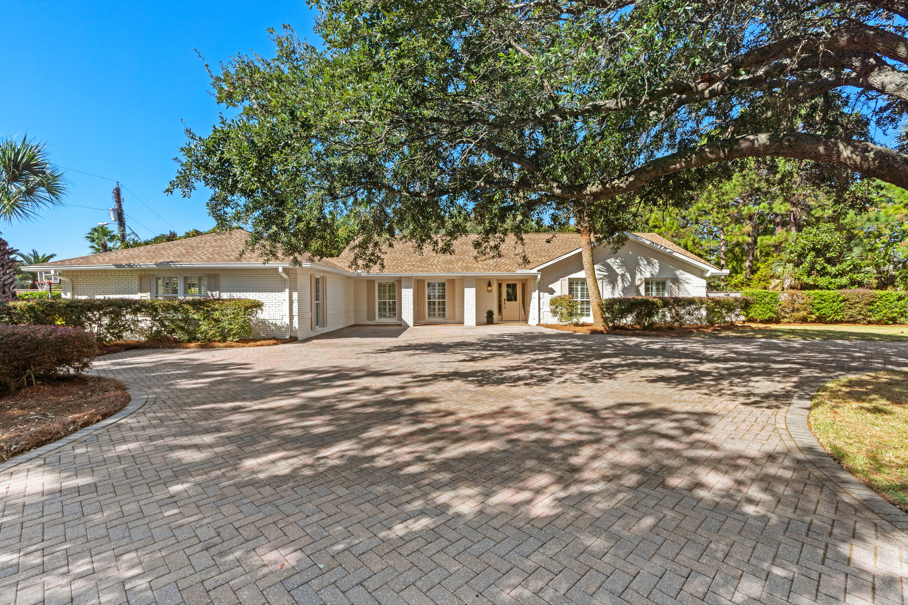 26 Sandestin Estates Drive Miramar Beach, FL 32550 - Photo 57 of 81 a front view of a house with a yard and garage