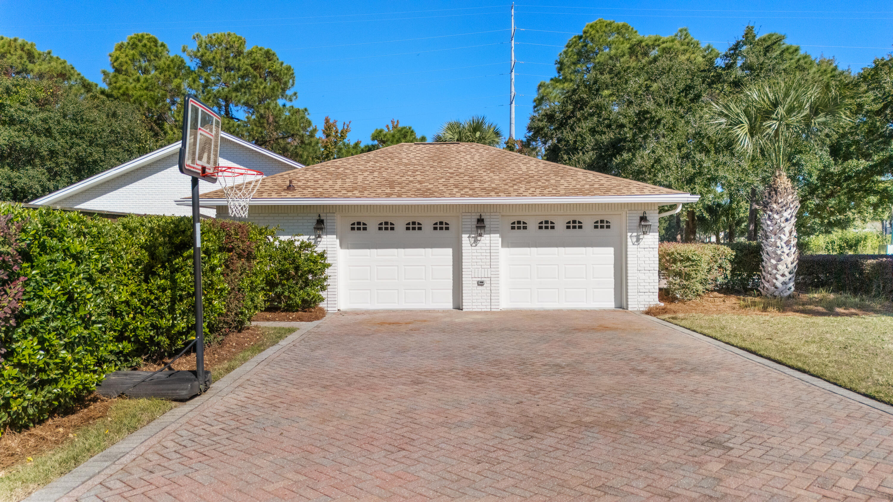 26 Sandestin Estates Drive Miramar Beach, FL 32550 - Photo 63 of 81 a front view of a house with a yard and garage