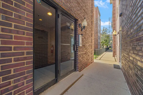 a view of a brick buildings with door