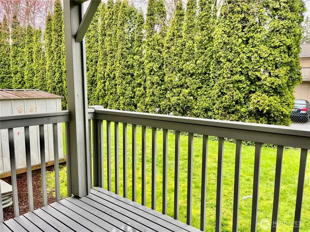 a view of balcony with wooden floor