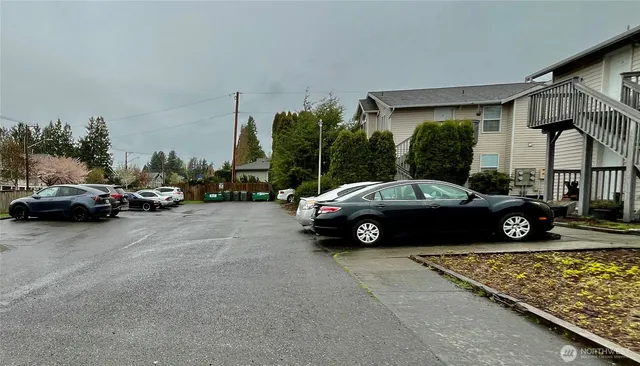 a view of a car parked in front of a house