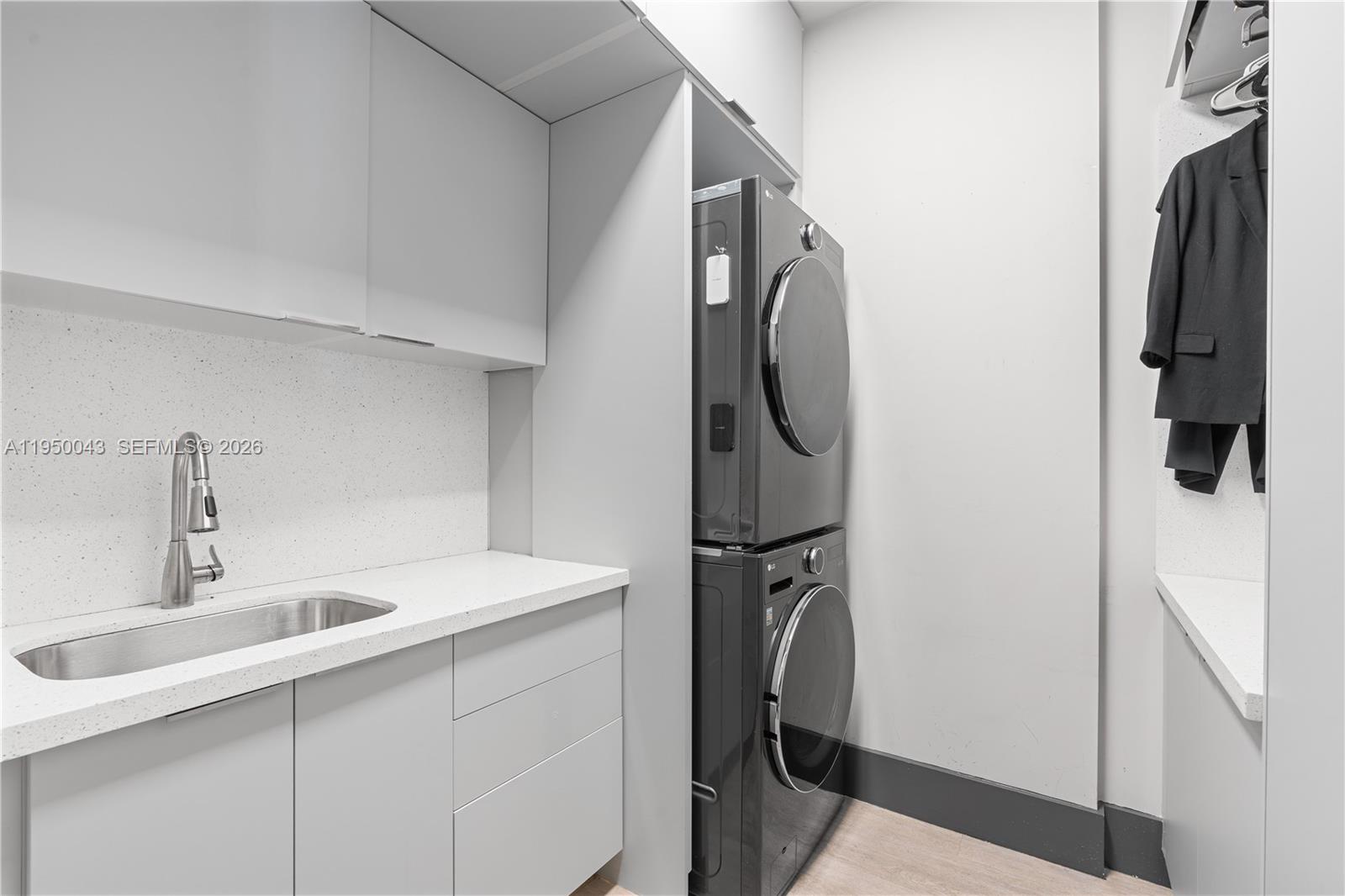 7345 Southwest 96th Street Pinecrest, FL 33156 - Photo 28 of 62 a utility room with dryer and washer