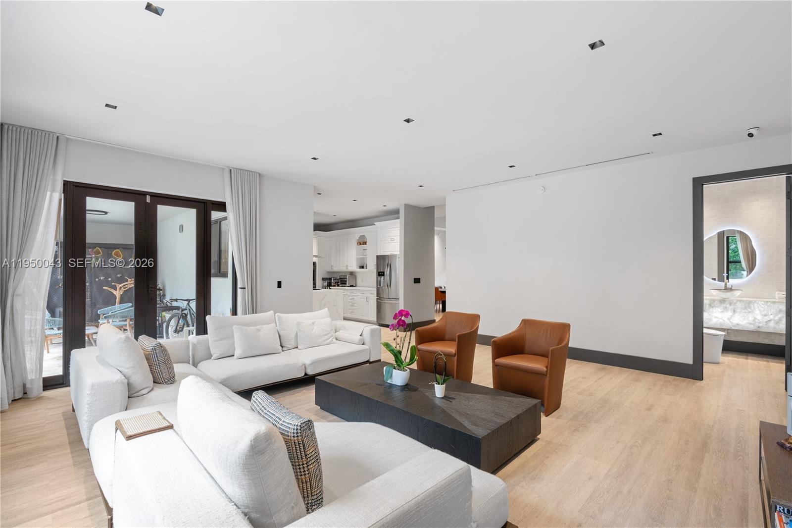 7345 Southwest 96th Street Pinecrest, FL 33156 - Photo 33 of 62 a living room with furniture and wooden floor