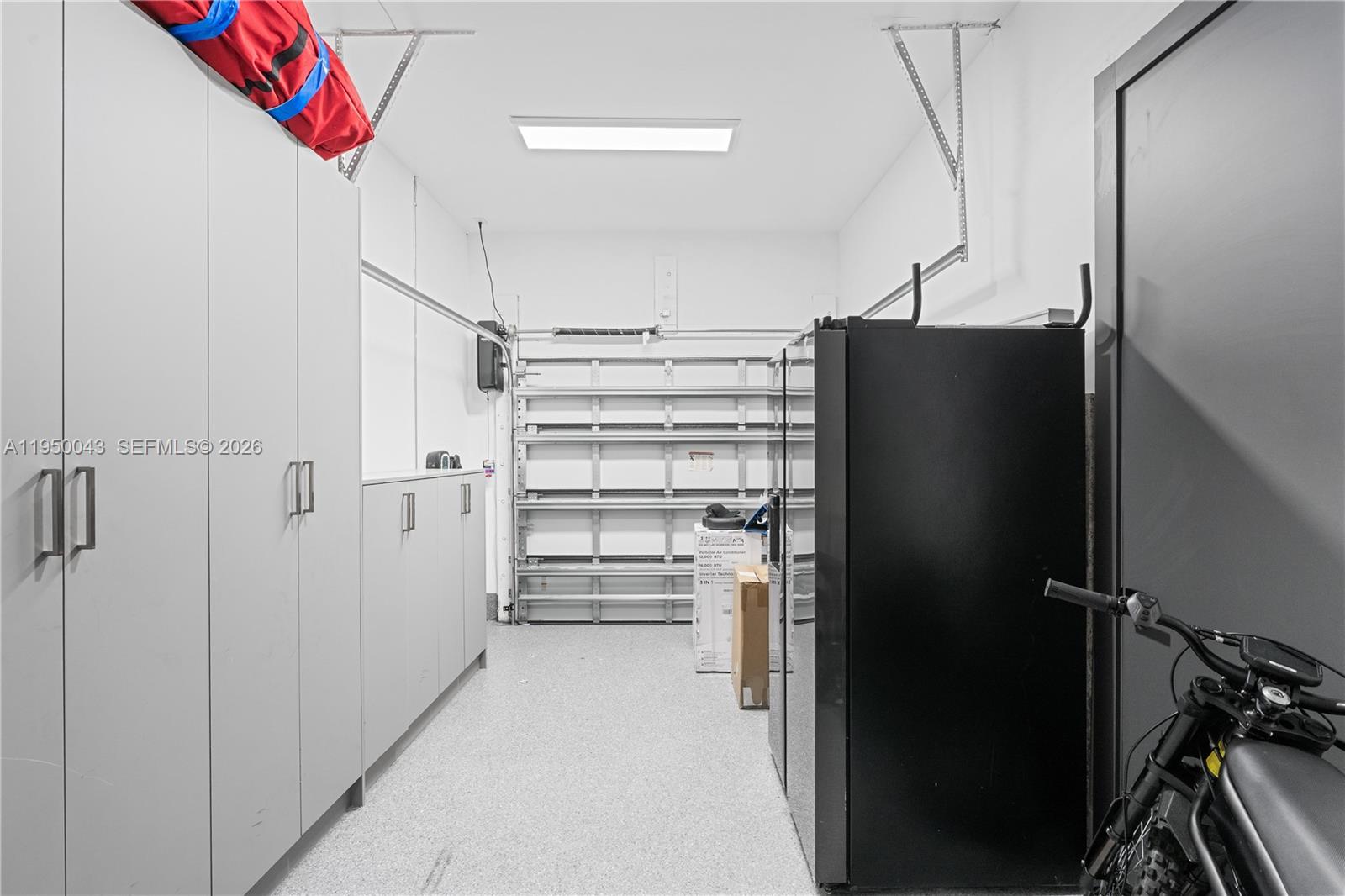 7345 Southwest 96th Street Pinecrest, FL 33156 - Photo 41 of 62 a kitchen with a refrigerator and a stove top oven