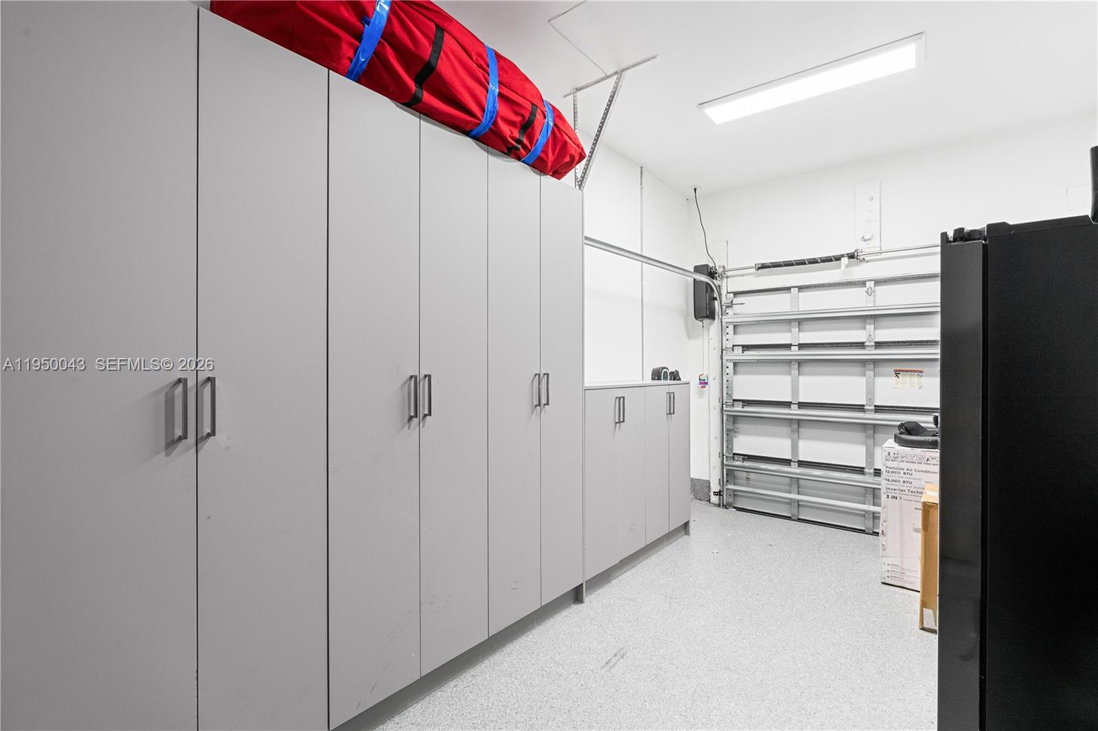 7345 Southwest 96th Street Pinecrest, FL 33156 - Photo 42 of 62 a view of walk in closet with empty racks