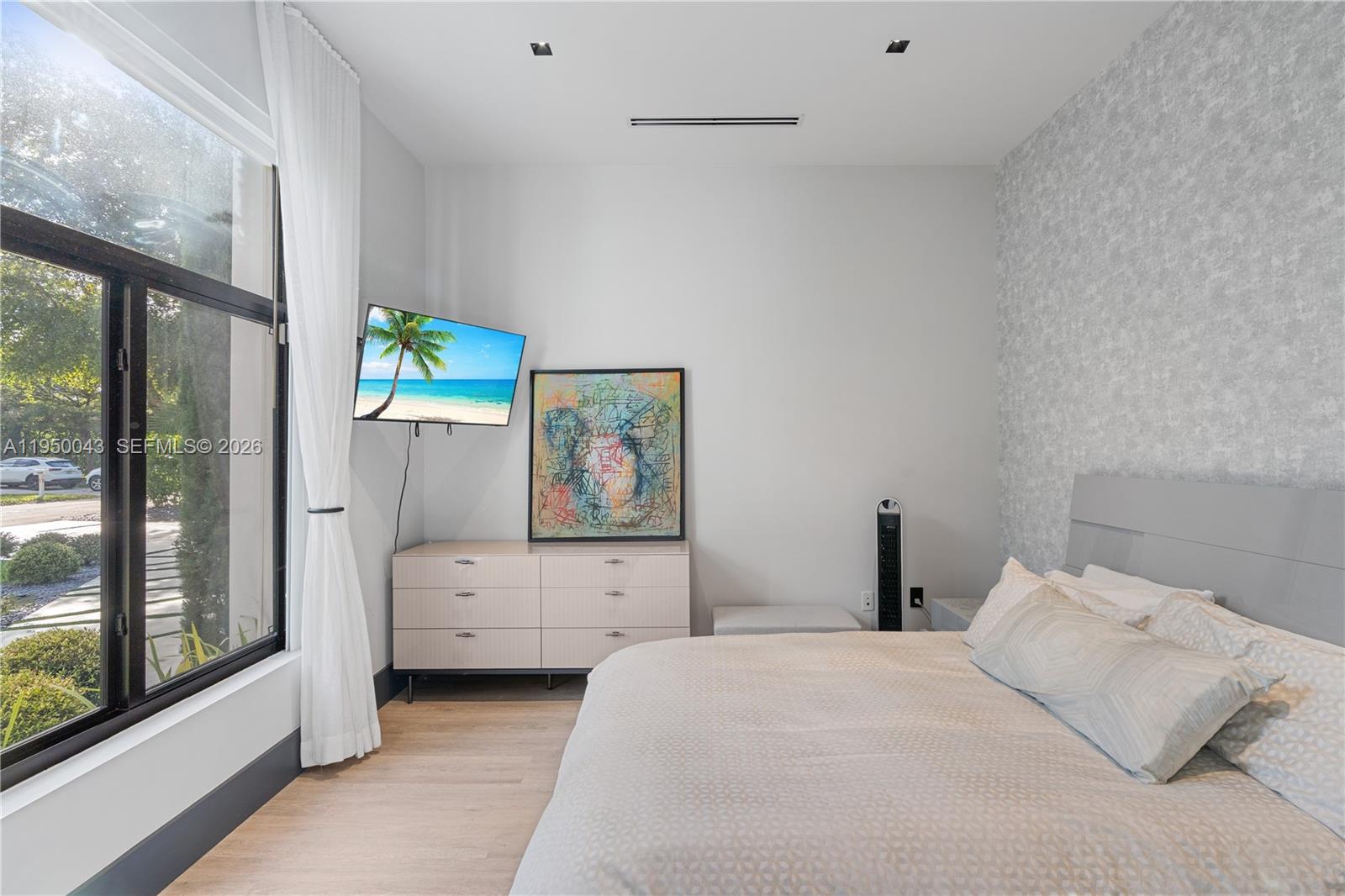 7345 Southwest 96th Street Pinecrest, FL 33156 - Photo 48 of 62 a bedroom with a bed and a window