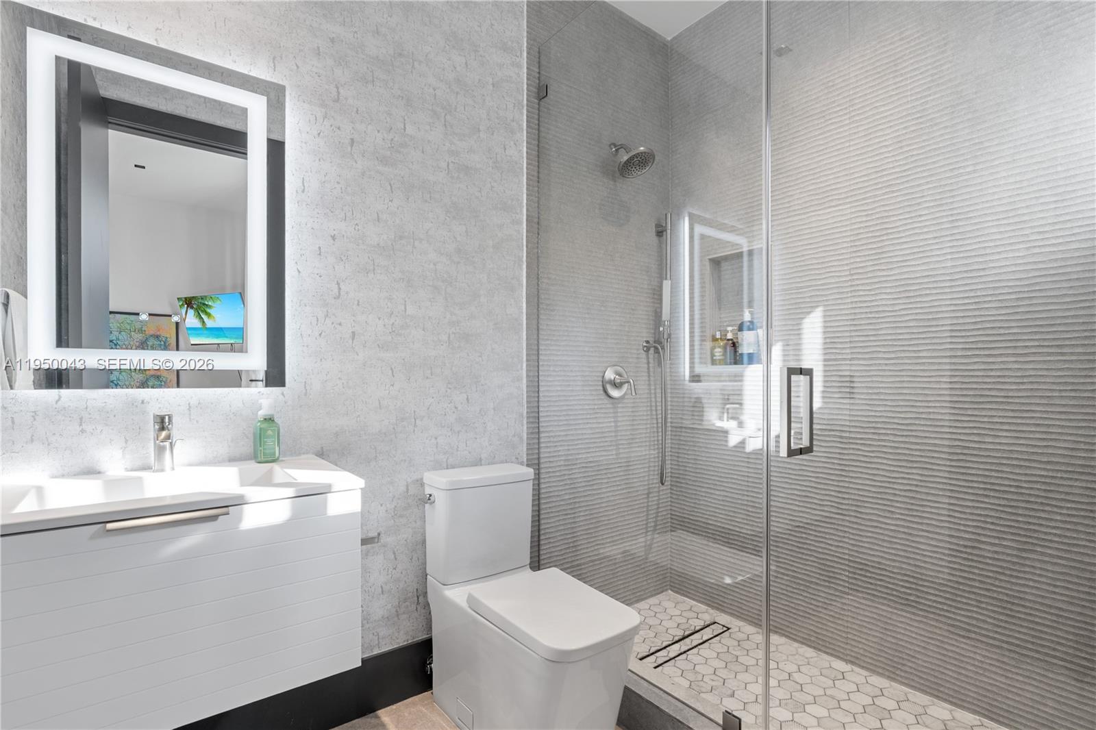 7345 Southwest 96th Street Pinecrest, FL 33156 - Photo 48 of 60 a bathroom with a sink toilet and shower