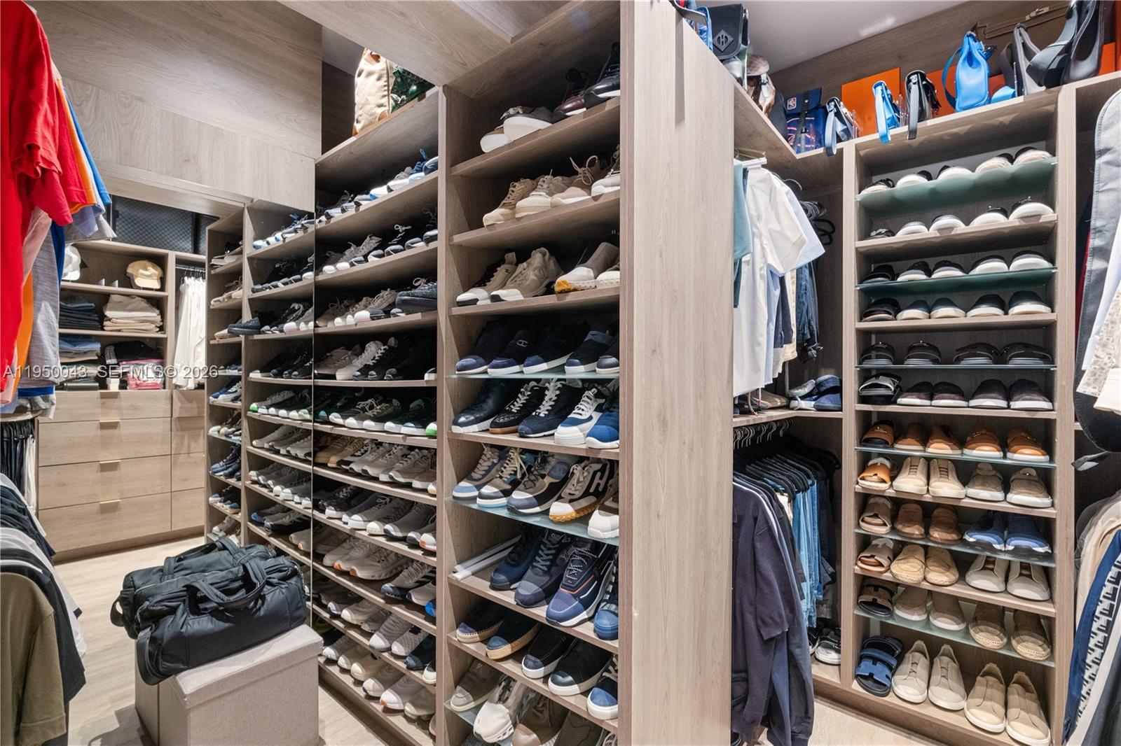 7345 Southwest 96th Street Pinecrest, FL 33156 - Photo 58 of 62 walk in closet with wooden floor