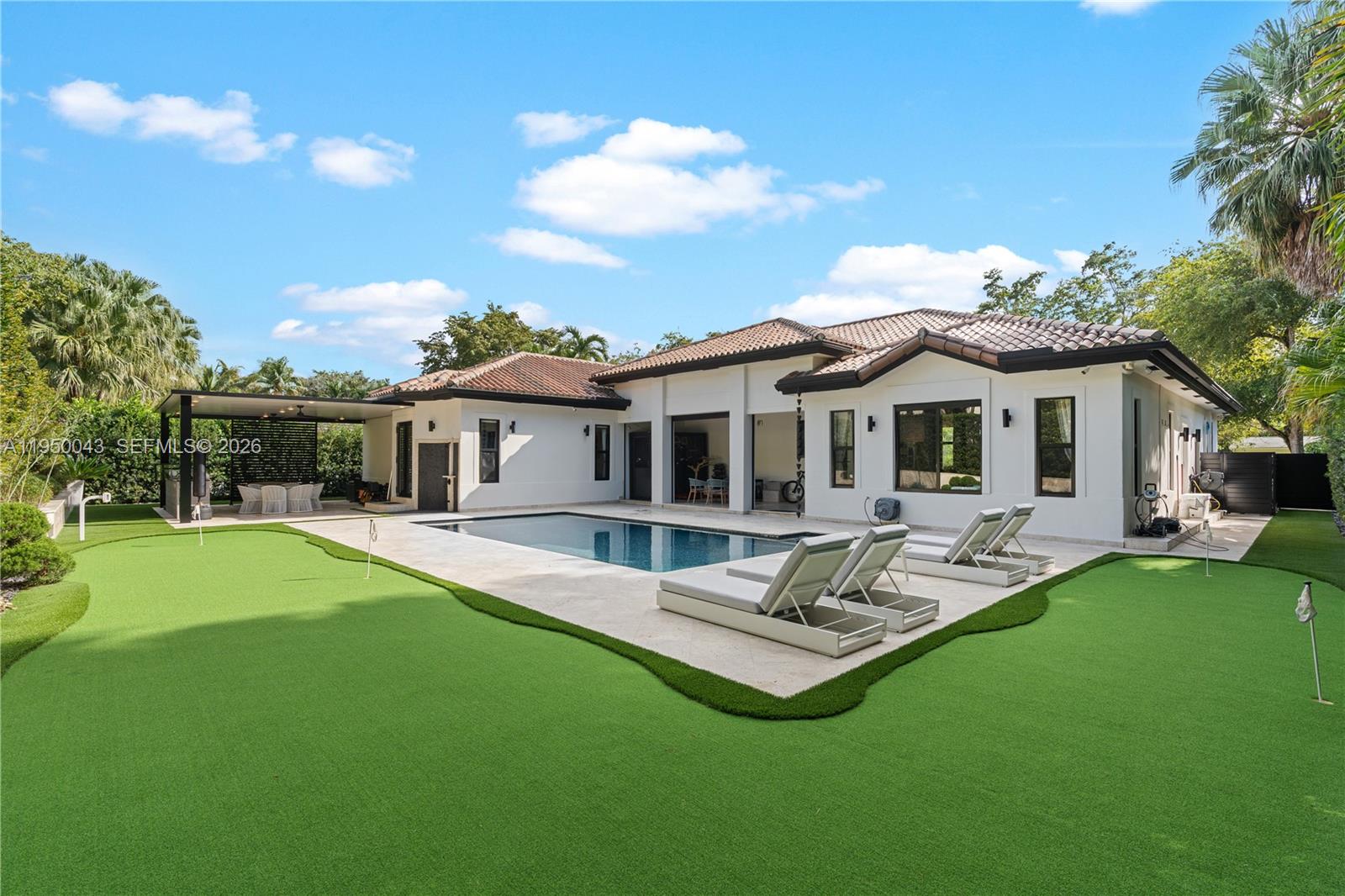 7345 Southwest 96th Street Pinecrest, FL 33156 - Photo 9 of 62 a garden view with a seating space and garden
