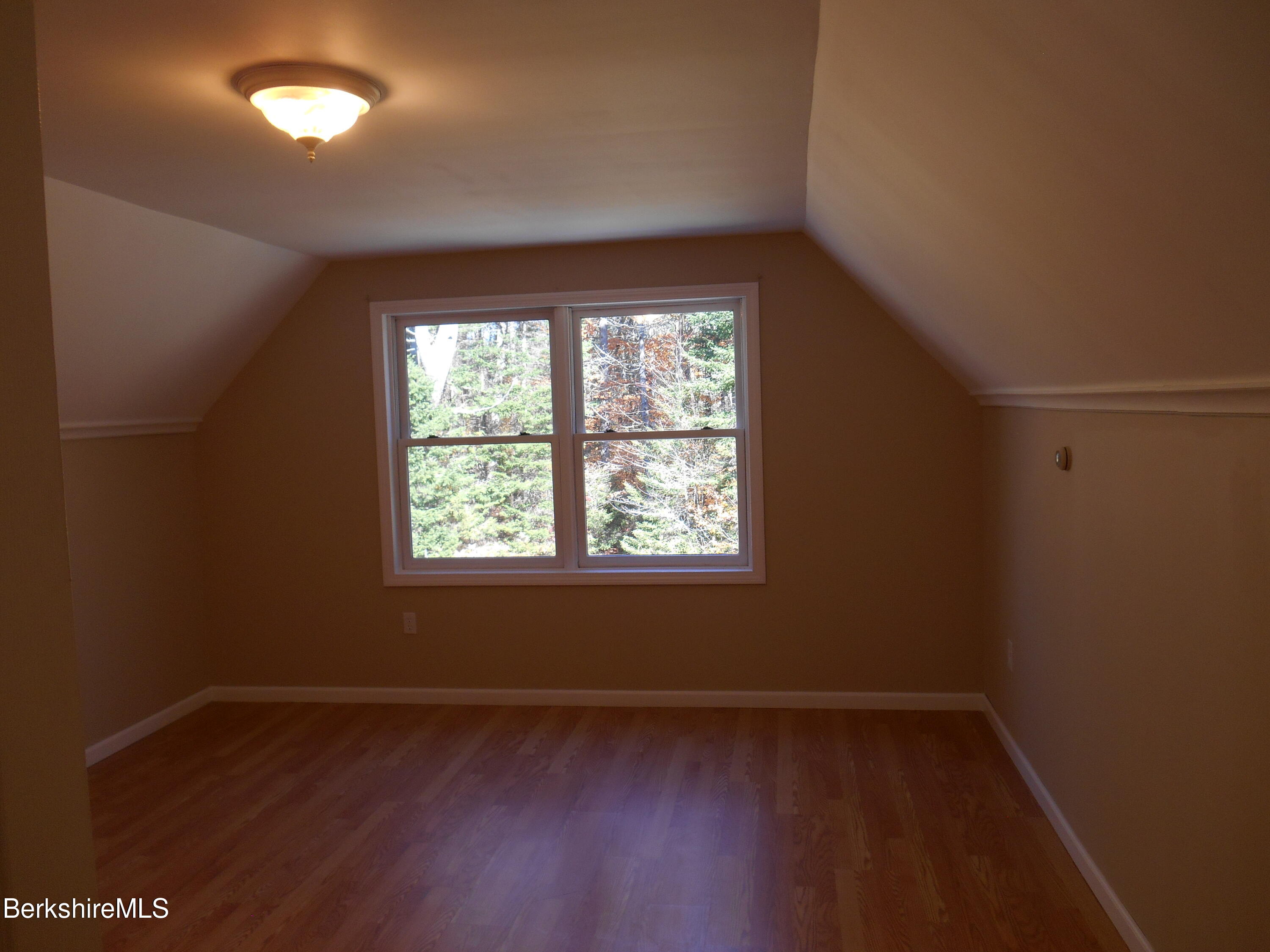 1742 East Windsor Road Windsor, MA 01270 - Photo 8 of 29 an empty room with wooden floor and windows