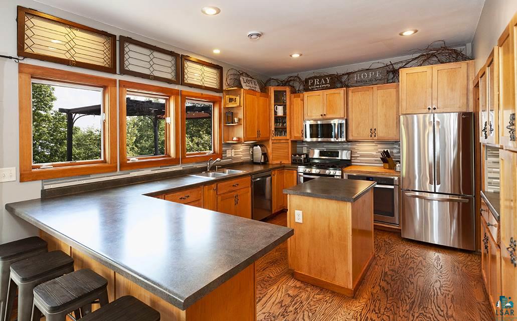5532 Fish Lake Dam Road Duluth, MN 55803 - Photo 8 of 25 THE KITCHEN HAS AN ISLAND & BREAKFAST BAR! LOOK AT ALL OF THE COUNTER SPACE!
