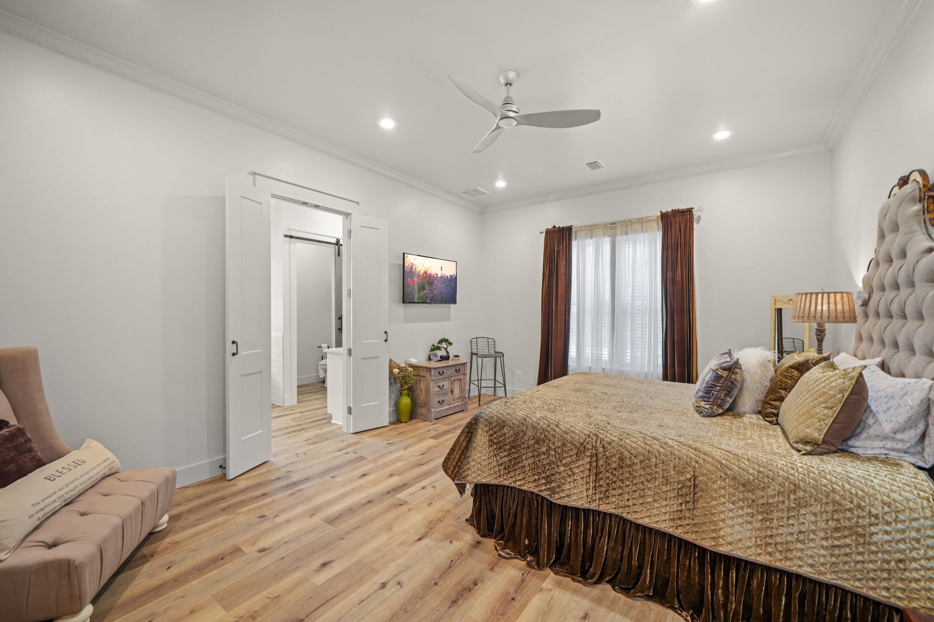 279 Smith Drive Santa Rosa Beach, FL 32459 - Photo 20 of 56 a bedroom with a bed and a flat screen tv