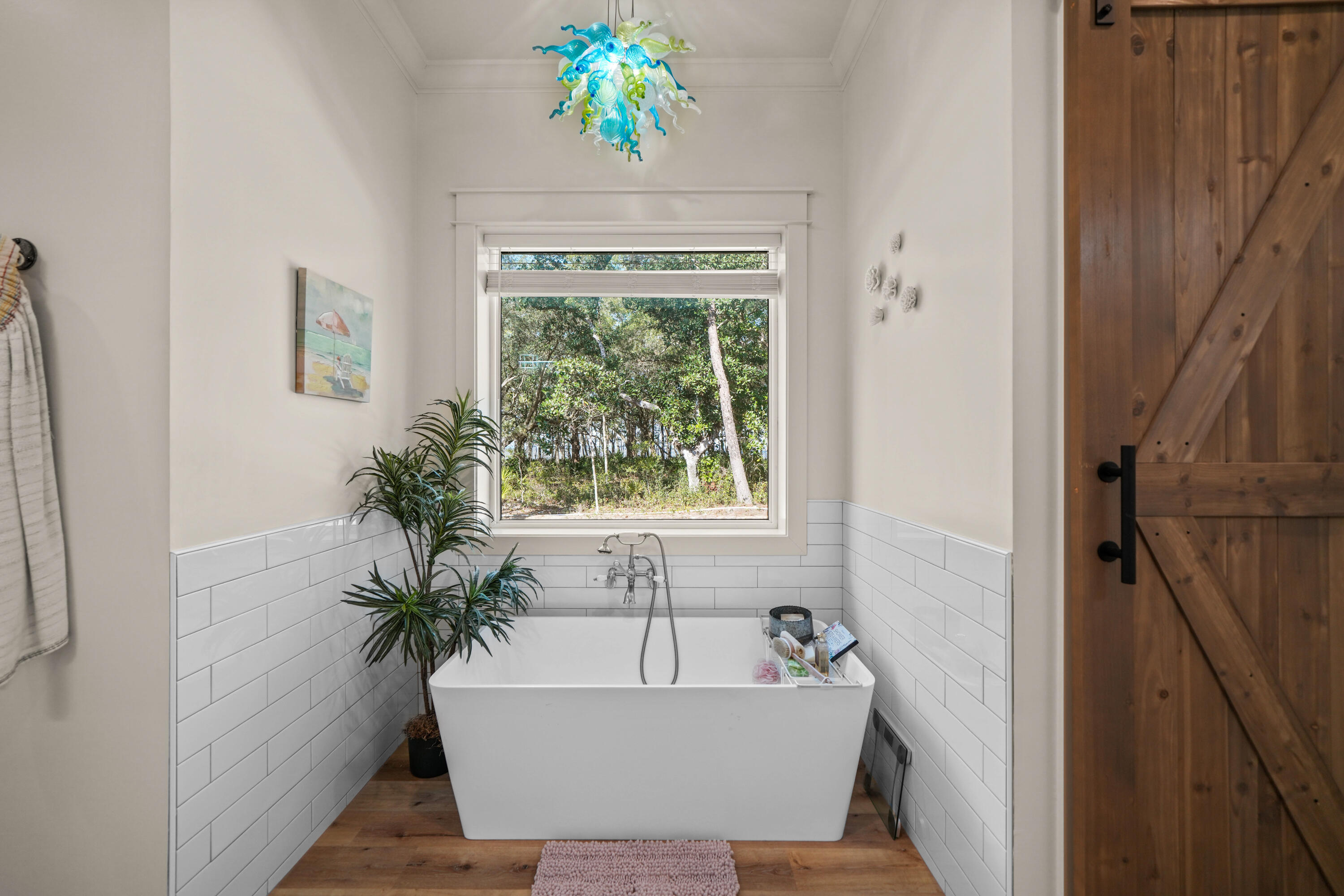 279 Smith Drive Santa Rosa Beach, FL 32459 - Photo 22 of 56 a bath tub sitting in a bathroom next to a window