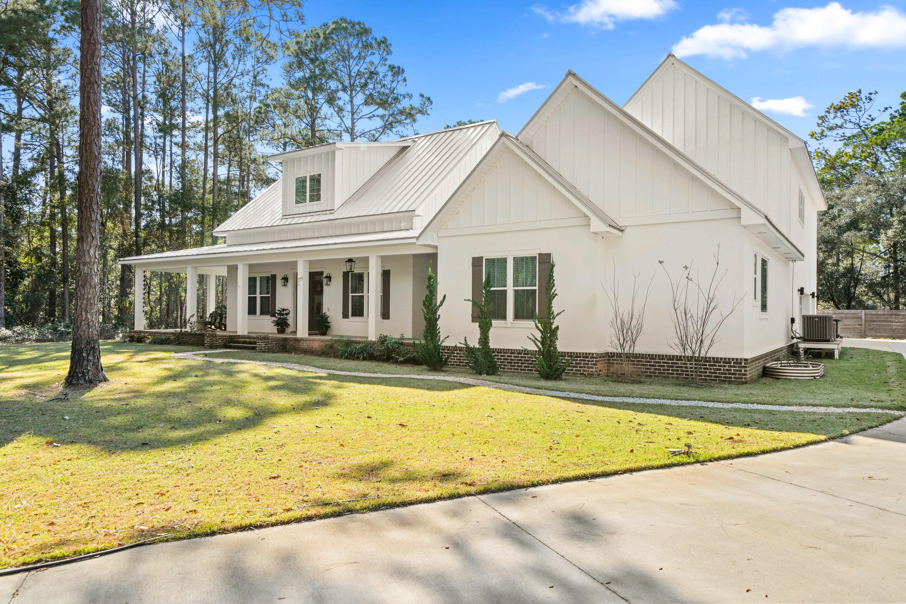 279 Smith Drive Santa Rosa Beach, FL 32459 - Photo 3 of 56 a view of a house with swimming pool and a yard