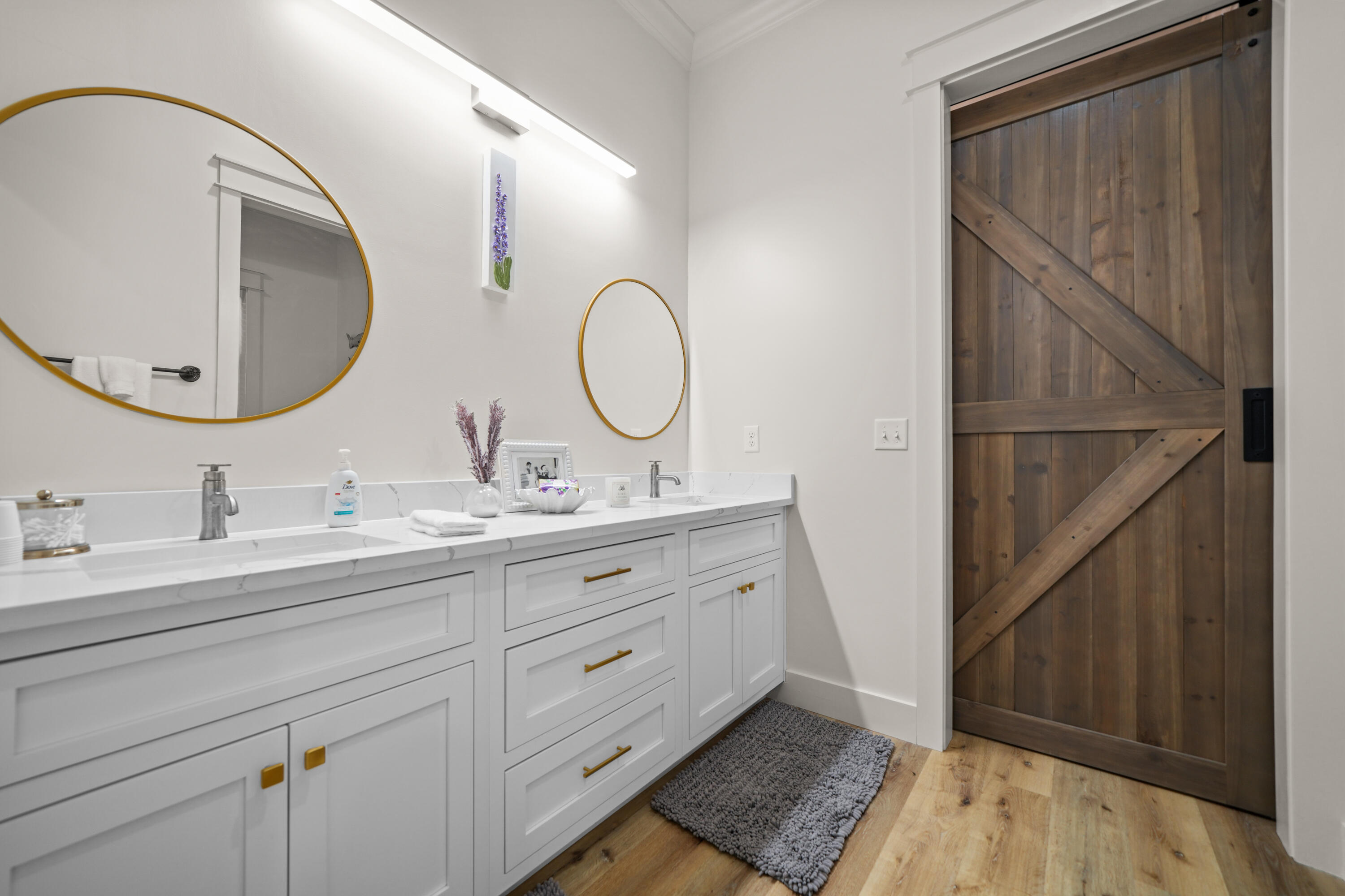 279 Smith Drive Santa Rosa Beach, FL 32459 - Photo 34 of 56 a bathroom with a double vanity sink and a mirror