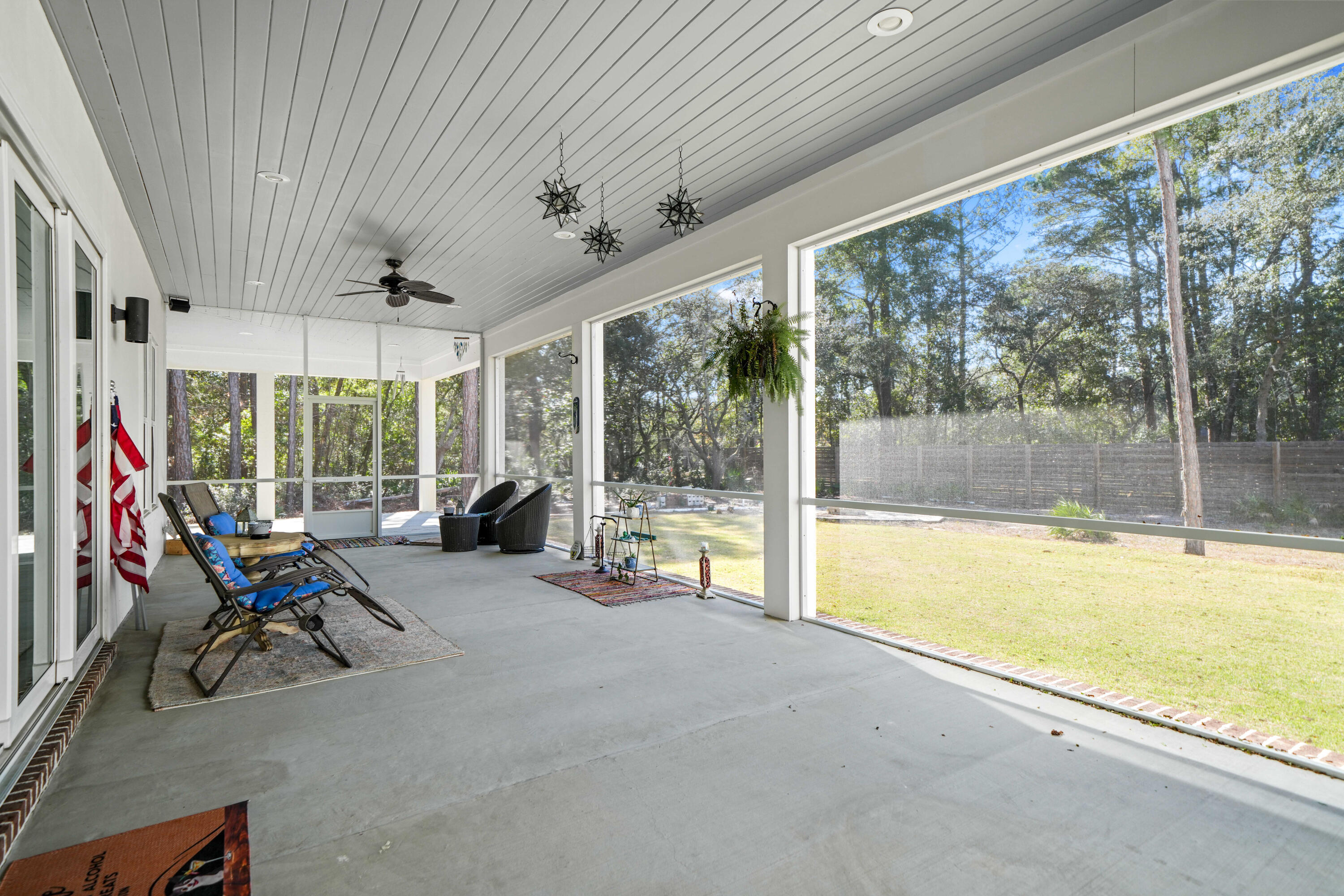 279 Smith Drive Santa Rosa Beach, FL 32459 - Photo 44 of 56 a view of a livingroom with furniture water view and a floor to ceiling window
