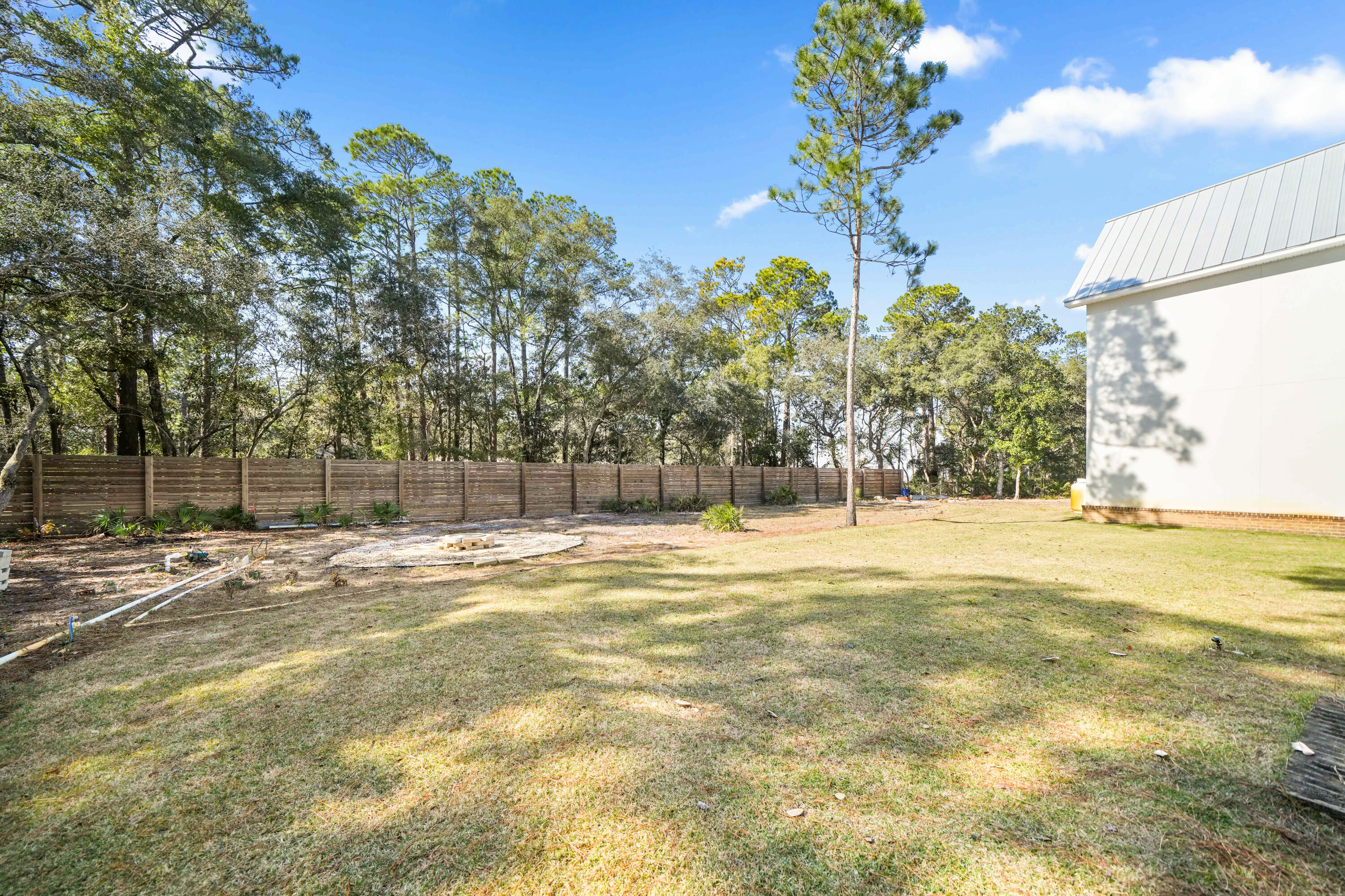 279 Smith Drive Santa Rosa Beach, FL 32459 - Photo 46 of 56 a view of a swimming pool with an outdoor space and seating area
