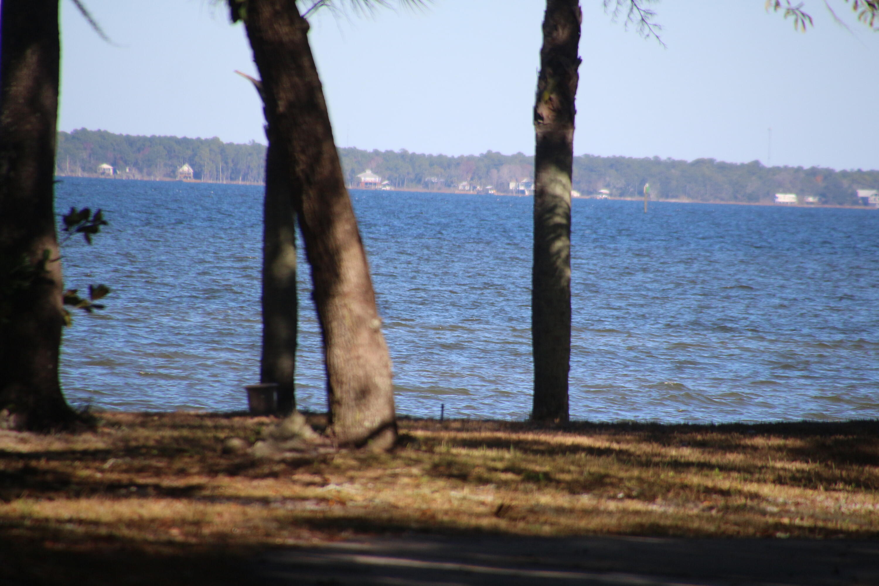 279 Smith Drive Santa Rosa Beach, FL 32459 - Photo 56 of 56 a view of a road with a building in the background
