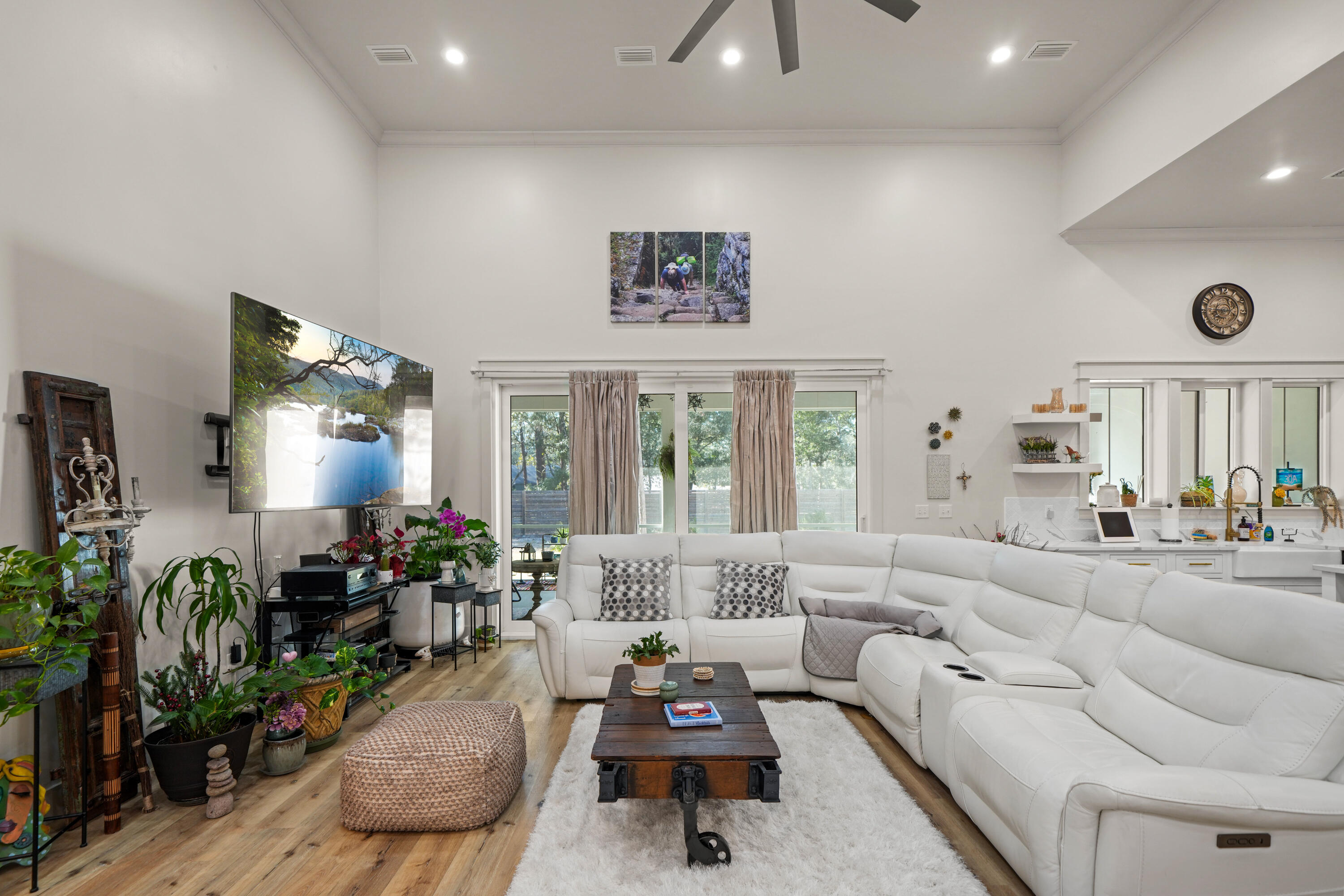 279 Smith Drive Santa Rosa Beach, FL 32459 - Photo 9 of 56 a living room with furniture flowers and a large window