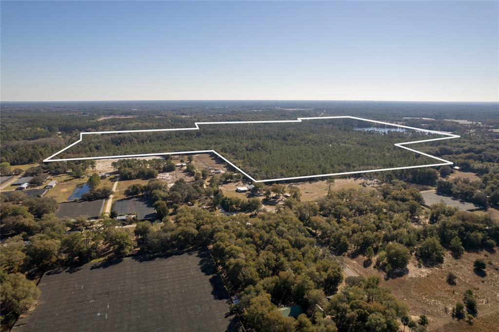 North Road Pierson, FL 32180 - Photo 3 of 13 an aerial view of residential houses with outdoor space