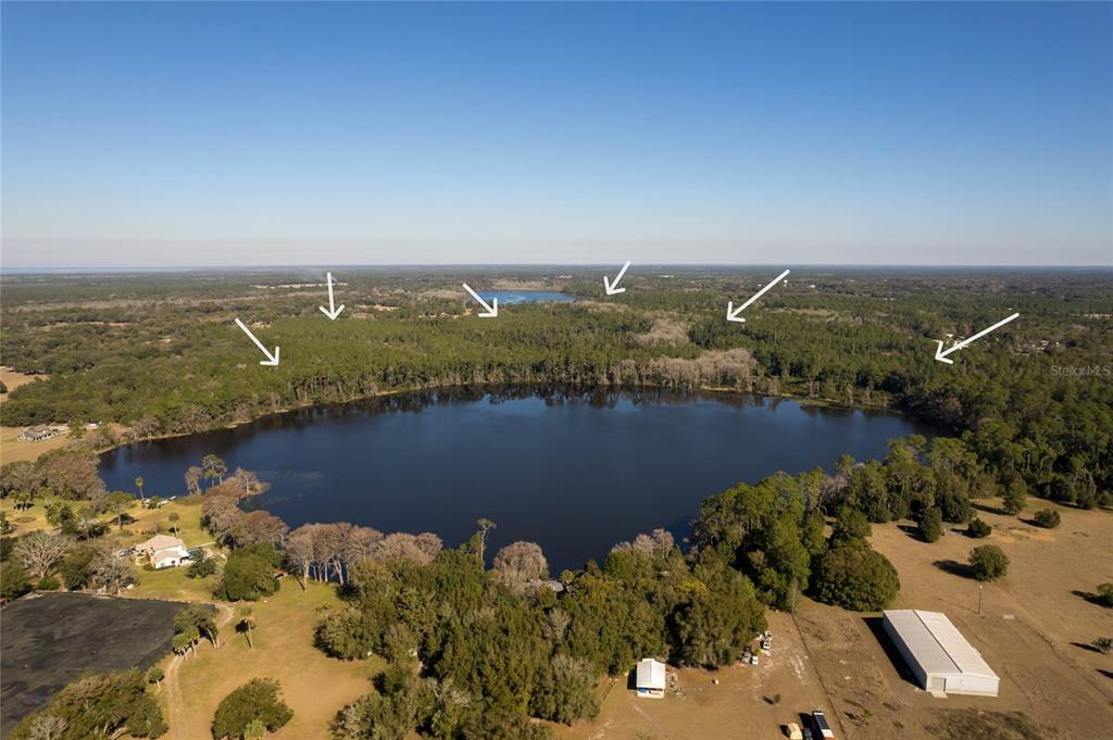 North Road Pierson, FL 32180 - Photo 8 of 13 an aerial view of a house with a lake view