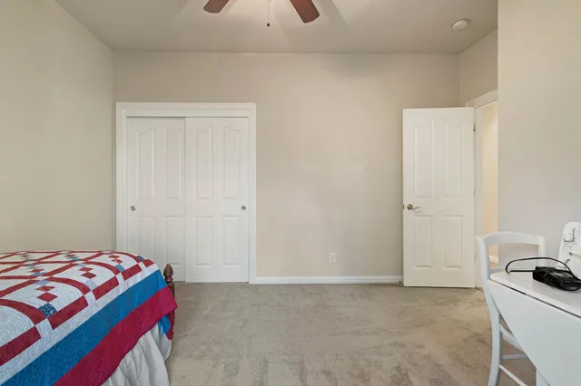 a bedroom with a bed and a cabinets