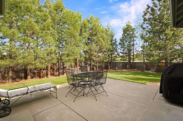 a view of a yard with furniture and a fire pit