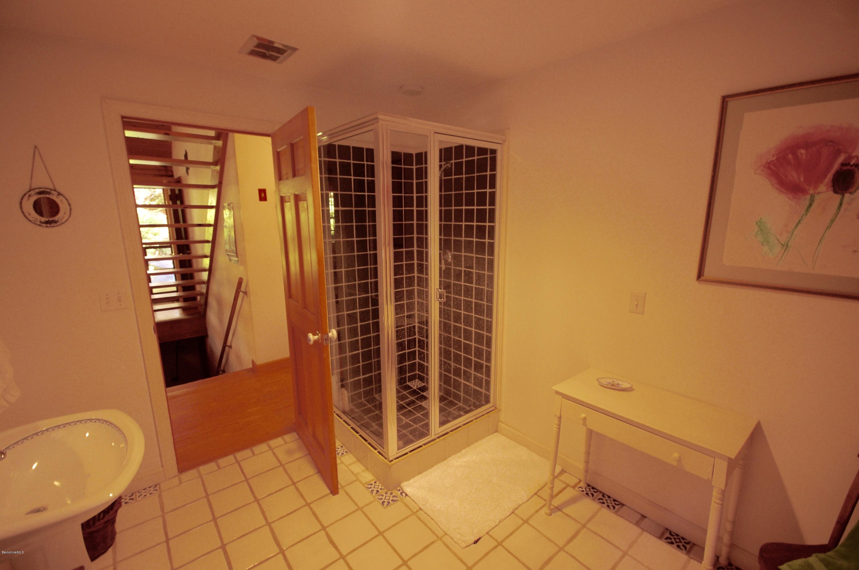 157 Chipman Road Middlefield, MA 01011 - Photo 6 of 11 a view of an empty room with wooden floor and a window