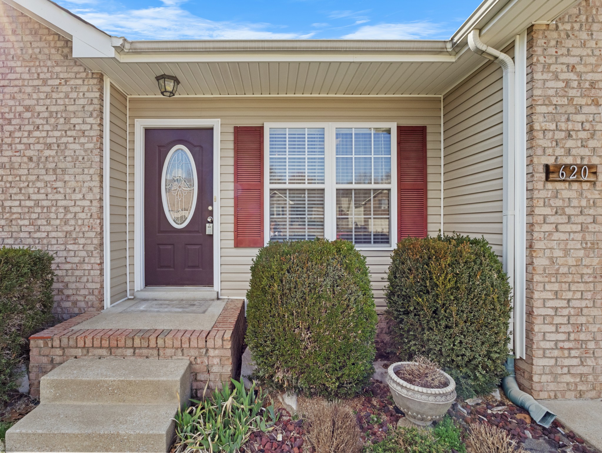 620 Wolfchase Drive Clarksville, TN 37042 - Photo 6 of 24 a view of a door of the house with potted plants