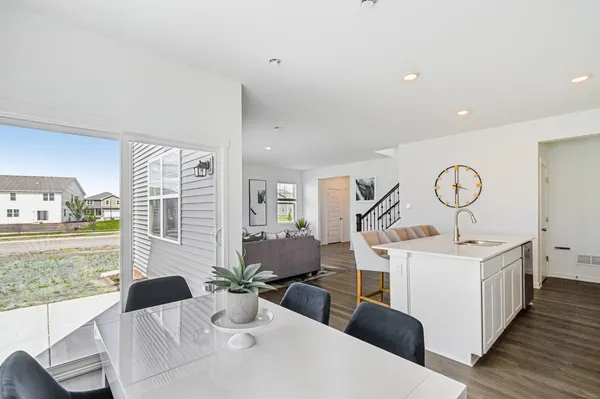 a living room with furniture a fireplace and a table