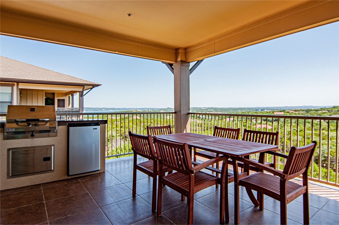 a view of a chairs and table on the terrace
