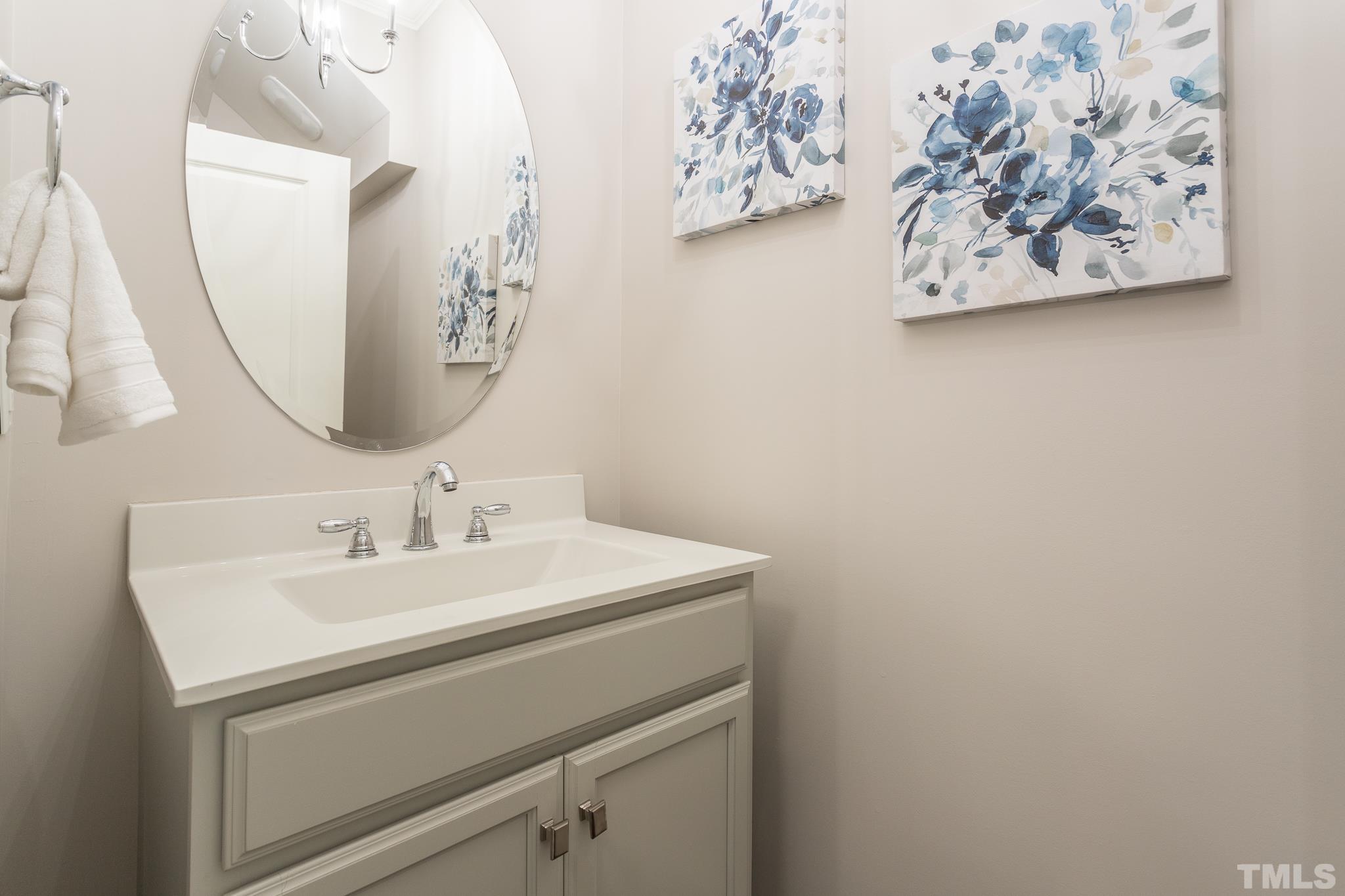 2809 Plumfield Place Raleigh, NC 27607 - Photo 16 of 25 a bathroom with a sink and a mirror