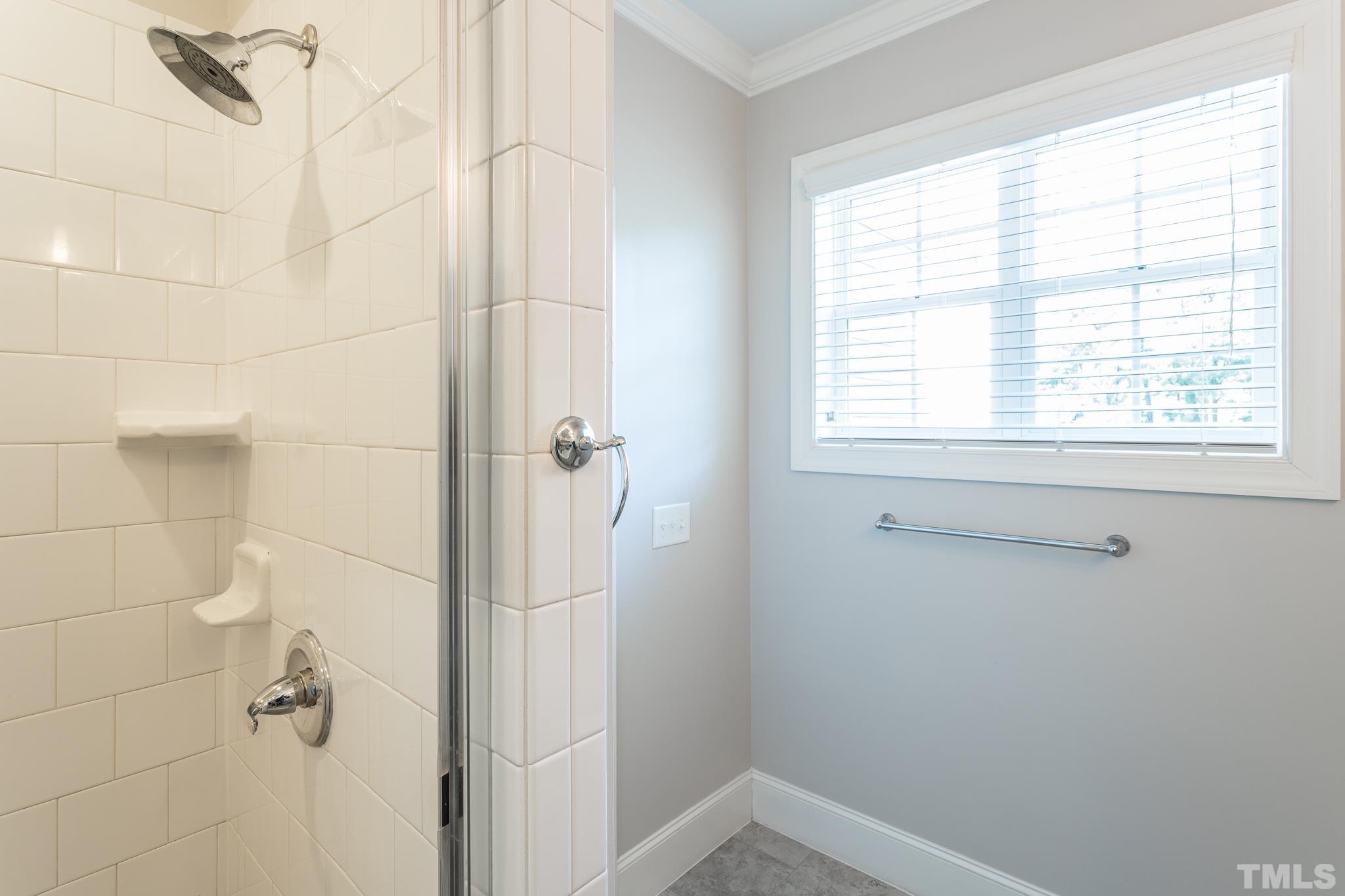 2809 Plumfield Place Raleigh, NC 27607 - Photo 18 of 25 a bathroom with a window
