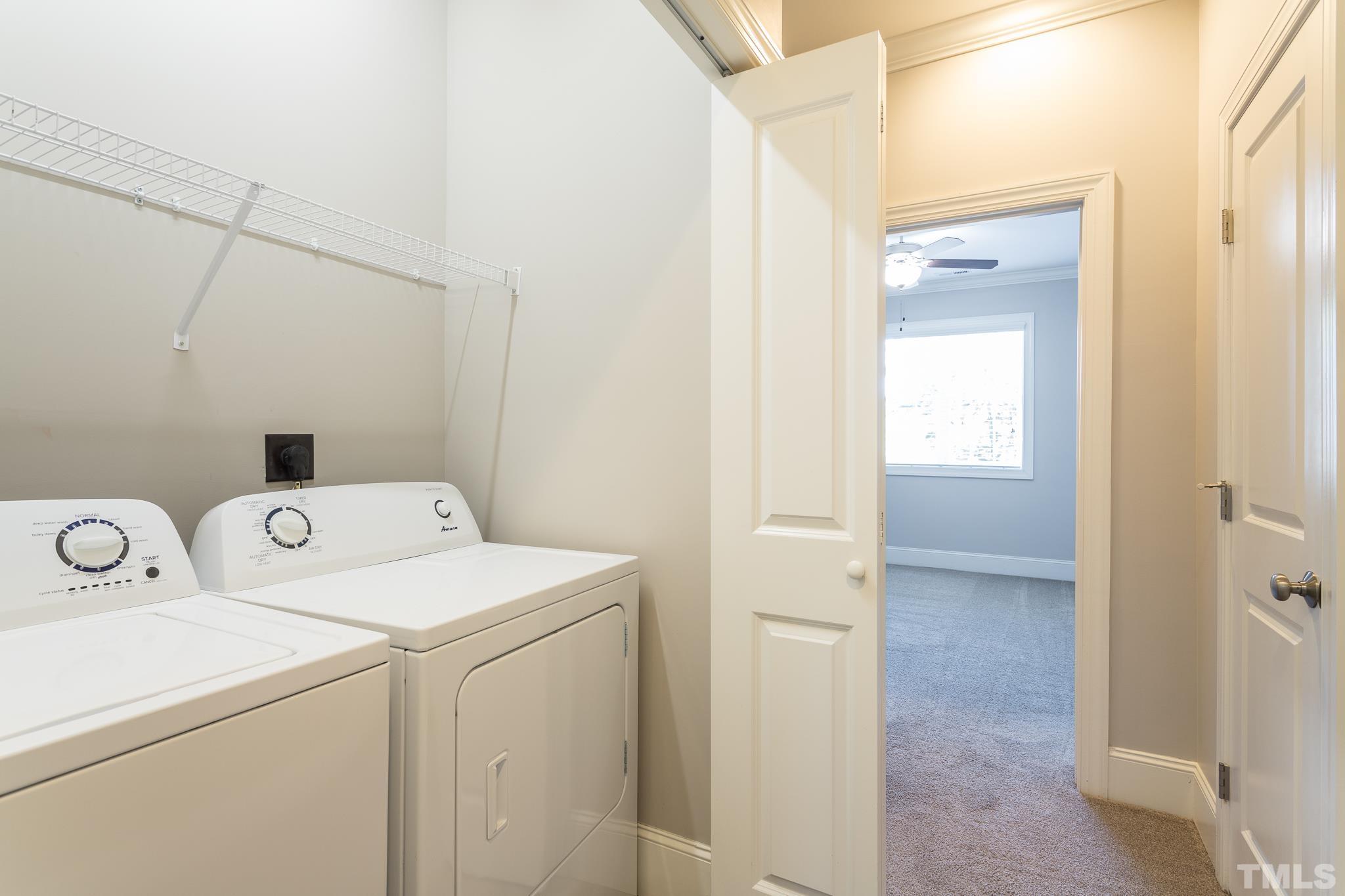2809 Plumfield Place Raleigh, NC 27607 - Photo 19 of 25 a view of storage and utility room with washer and dryer