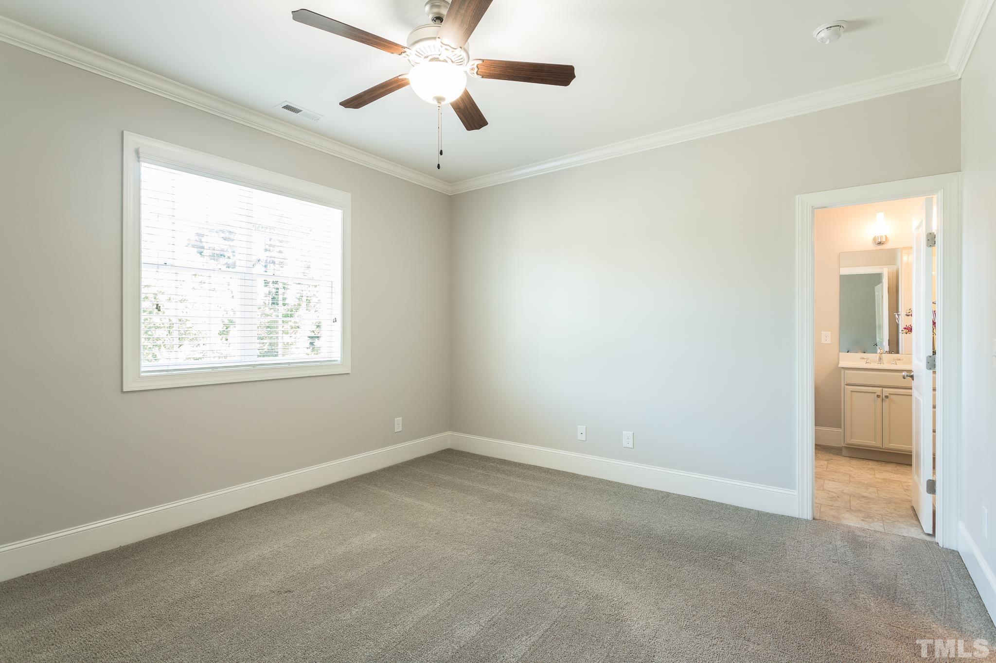 2809 Plumfield Place Raleigh, NC 27607 - Photo 5 of 25 a view of an empty room with a window